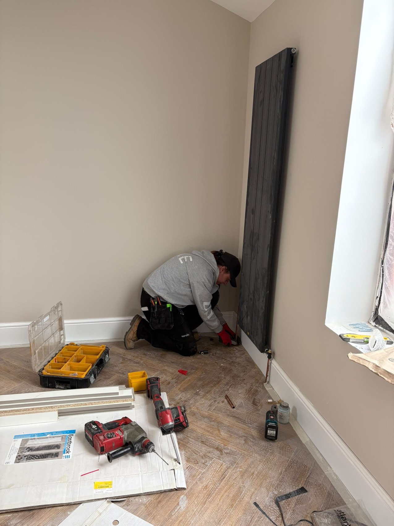 Hannah, fully-trained plumber at Rapid Plumbing & Build, on a job in Sheffield