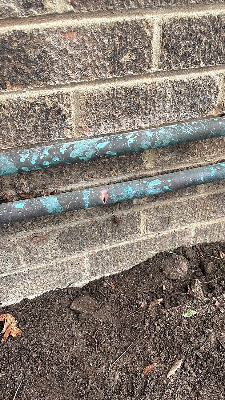 Corroded underground supply pipe with a leak, before repair by Rapid Plumbing and Build in Sheffield
